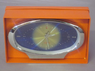 An Oriental alarm clock, boxed