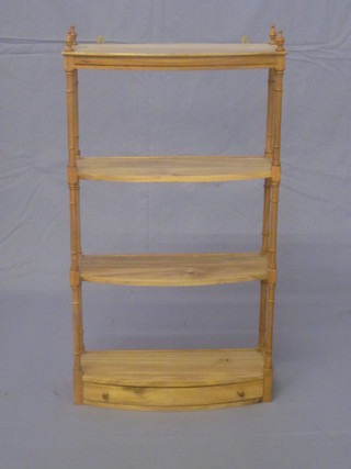 A Georgian style bleached mahogany bow front 3 tier what-not, the base fitted a drawer and raised on turned and block supports  29"