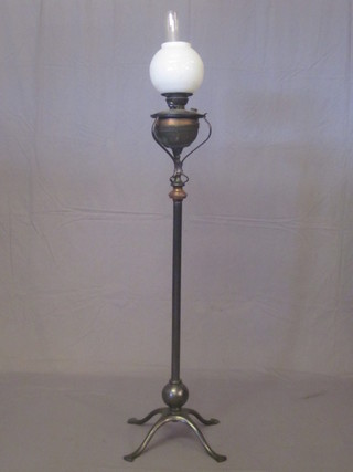 An iron adjustable oil lamp stand complete with reservoir