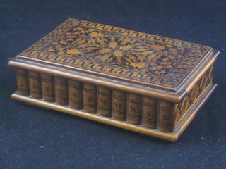 A Tunbridge ware style box, the hinged lid inlaid, having a  secret locking mechanism to the front, the front decorated a range  of books, the interior containing a mother of pearl button and  cufflink 6"