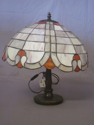 A bronze Liberty style table lamp with stained glass shade