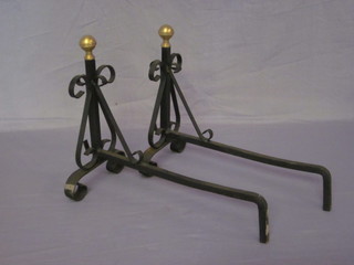 A pair of wrought iron fire dogs