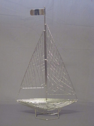 A pierced metal model of a yacht 12"