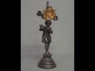 An Art Nouveau style table resin table lamp in the form of a standing girl with flute, complete with shade 23"