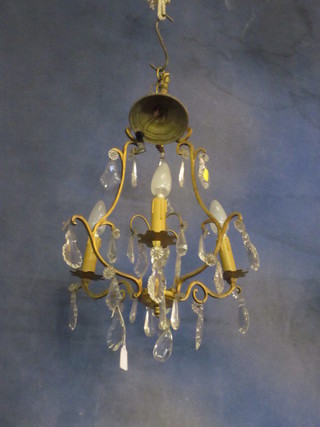A French gilt metal 3 light electrolier hung lozenges
