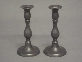 A pair of 19th Century pewter candlesticks with ejectors 8"