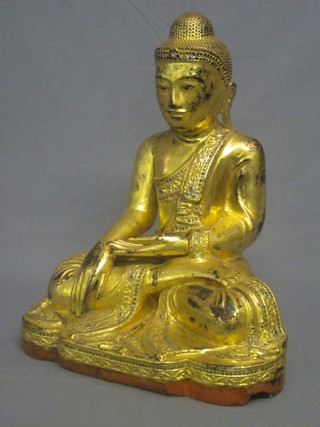 A carved wooden figure of a seated Buddha 16"   ILLUSTRATED