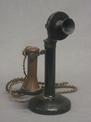 A metal internal candlestick telephone