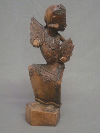 An Eastern carved figure of a standing lady 15"