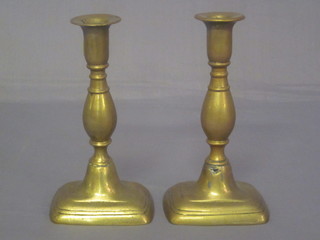 A pair of 19th Century brass candlesticks with ejectors 7 1/2"