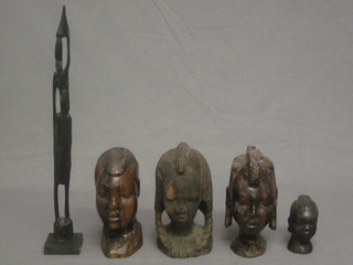 4 carved African bust portraits 6" and 4" together with a standing figure of a lady