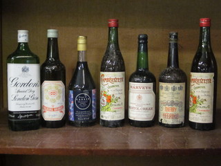 A litre bottle of Gordon's gin, a bottle of Harvey's Bristol Cream  sherry and 5 other bottles of liqueur