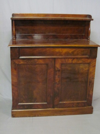 A Victorian mahogany chiffonier with raised back, the base fitted  a drawer above a double cupboard, raised on a platform base 40"