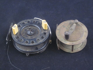 A brass centre pin fishing reel 2", together with a Morritt's New  Popular Centre pin fishing reel