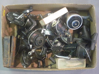 A Mitchell 840 fishing reel, a Mitchell 810 fishing reel and 8 other fishing reels and lures etc