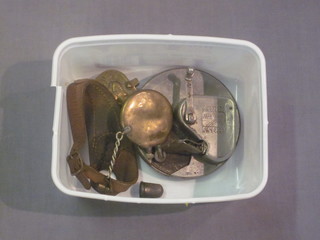 A Kriss Kross razor blade sharpener, a sail maker's thumb guard,  a brass trinket box and a brass lighter