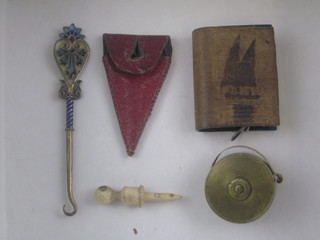 2 19th Century miniature brass tape measures, a pair of miniature scissors, a button hook and a Stanhope