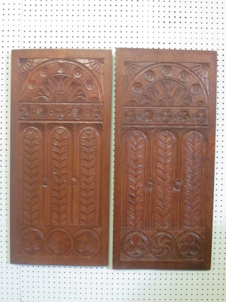 A pair of carved wooden panels 31" x 14"