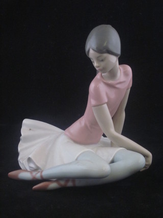 A Lladro figure of a seated Ballerina, the base marked 1357 7"