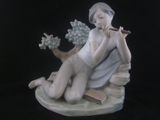 A Lladro figure of a seated boy playing the flute 8", 2 fingers missing 