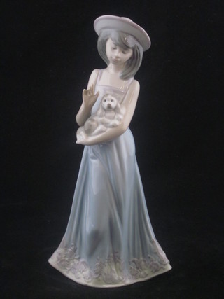 A Lladro figure of a standing girl with puppy 7", base impressed  5645