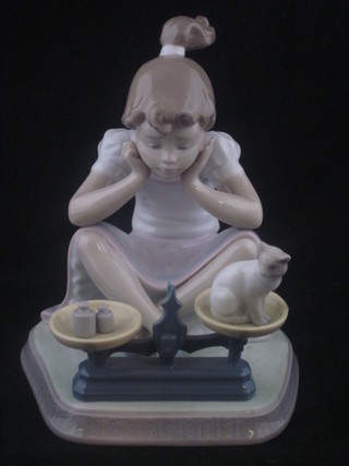 A Lladro figure of a seated girl with kitten, base marked 5474 6"  ILLUSTRATED