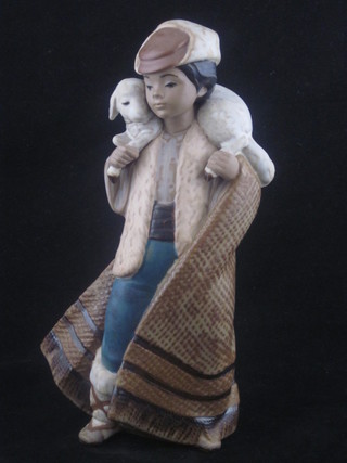 A Lladro figure of a standing Shepherd with sheep 9"