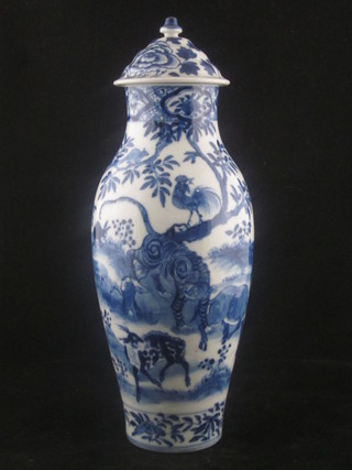 An Oriental blue and white porcelain jar and associated cover decorated animals, the base with 4 character mark, 12"