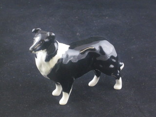 A Beswick figure of a standing Border Collie, the base with gold  mark 3"