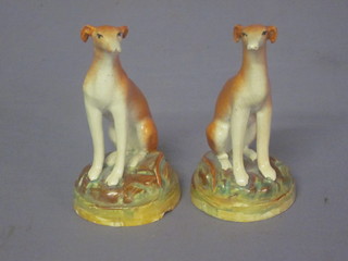 A pair of 19th Century Staffordshire figures of seated greyhounds  4"