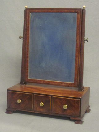 A Georgian rectangular bevelled plate dressing table mirror  contained in a mahogany swing frame, the base fitted 3 drawers,  raised on bracket feet 17"