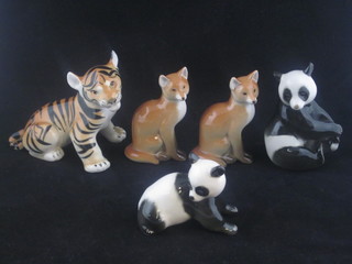 A pair of Soviet Russian porcelain figures of foxes, do. Pandas  and a tiger
