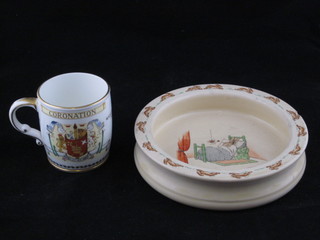 An Elizabeth II Coronation mug together with a circular Royal Doulton Bunnykins bowl, chipped,