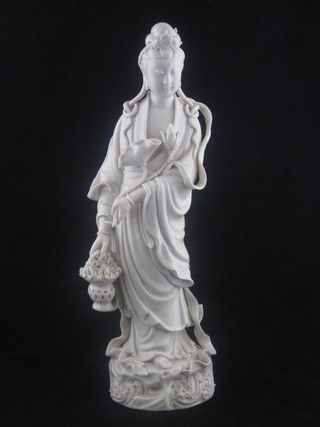 An Oriental blanc de chine figure of a standing Quing Lis 12"