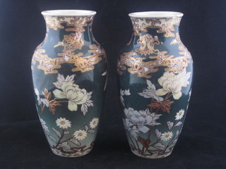 A pair of Oriental green glazed vases with floral decoration 8"