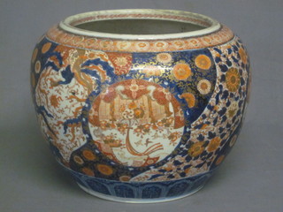 A large 19th Century Japanese Imari porcelain jardiniere with  floral decoration, star crack the base,  ILLUSTRATED