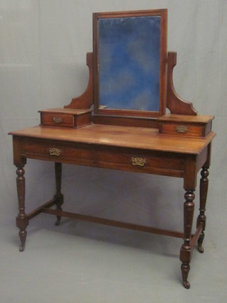 An Art Nouveau walnut dressing table with mirror over, the base fitted 2 glove drawers above 2 long drawer, raised on turned and  block supports with H framed stretcher 42"