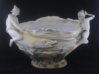 A Continental porcelain twin handled boat shaped jardiniere  decorated fish and naked female figures, 14", some chips