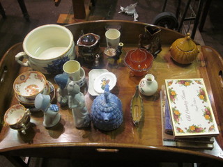 A Nao figure of a standing lady, f and r, a Prices teapot in the form of Toby Philpots, f and r, a blue floral patterned chamber  pot, a gurgling fish jug, a teapot in the form of Crinoline lady, 2  jars, cartoon books and a collection of decorative ceramics