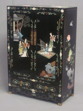 An Eastern black lacquered cabinet fitted shelves 24"