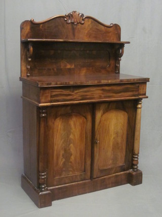A Victorian mahogany chiffonier with raised back, the base  fitted a drawer above a double cupboard and with columns to the  side 36"