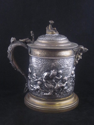 A large and impressive 19th Century embossed silver plated jug  with parcel gilt interior with hinged lid, the body cast  Bacchanalian scenes, the base marked J G & Sons   ILLUSTRATED