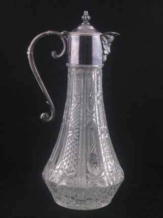 A cut glass claret jug with silver plated mounts