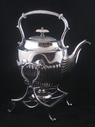 An oval Britannia metal tea kettle with demi-reeded decoration, complete with spirit burner
