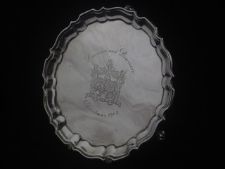 A silver salver with bracketed border, raised on 3 scroll feet, engraved the Arms of The Armories and Braziers Company  Christmas 1902 by Mappin Bros. London 1902, 6 ozs   ILLUSTRATED