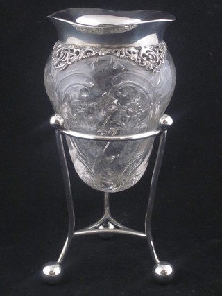 A Victorian cut glass tear drop shaped vase with silver mount, London 1899, raised on a silver plated stand