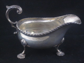 A Georgian style silver sauce boat with C scroll handle, London  1917, retailed by Harrods, 5 ozs