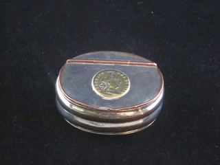 An oval 19th Century silver plated pocket snuff box with hinged lid, the lid set a coin