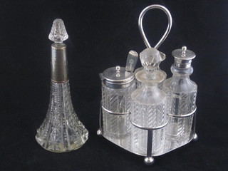 A cut glass perfume bottle with oval silver mount, together with  a glass and silver plated cruet set