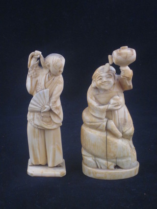 A carved ivory figure of a standing lady 4" and 1 other of a  gentleman 4"